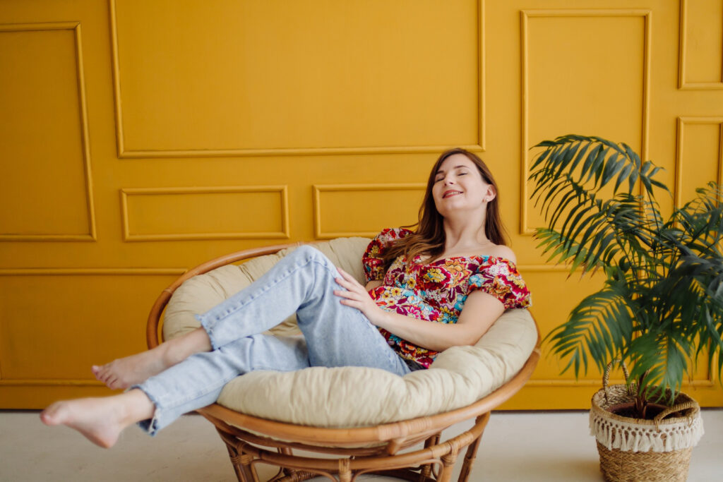 a woman siting in comfortable furniture