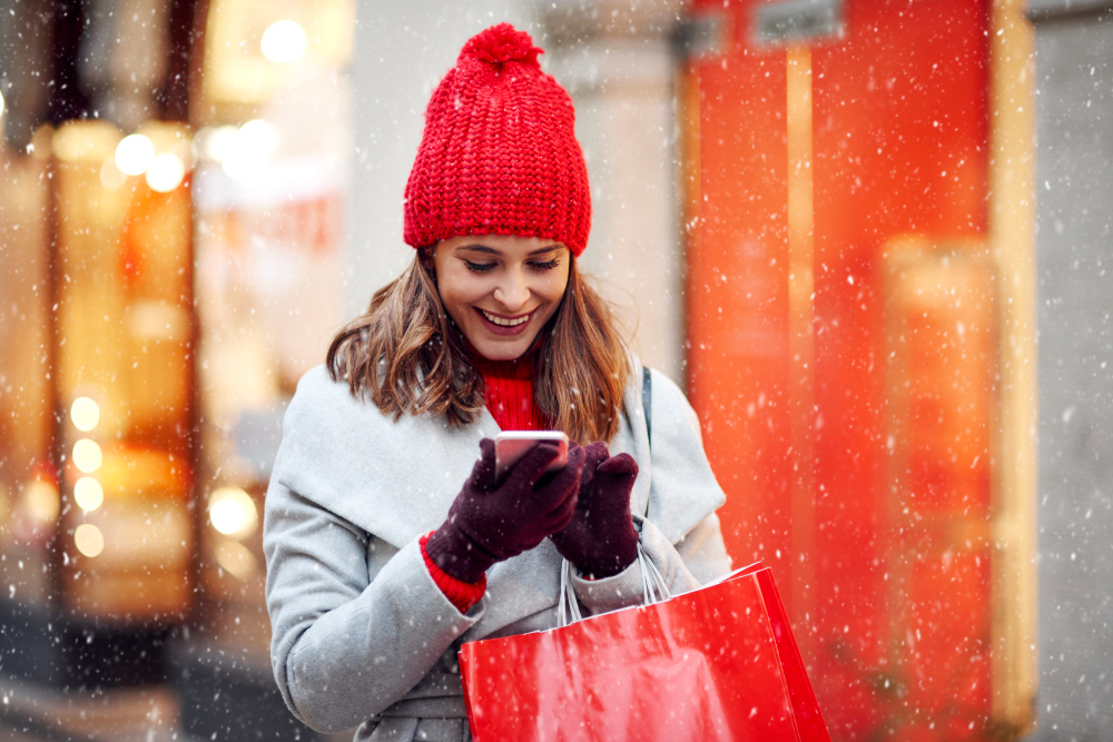 woman shopping and having fun with the best christmas apps