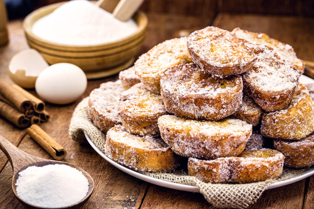 bread tray with cinnamon and fried sugar, typical brazilian dessert called rabanada