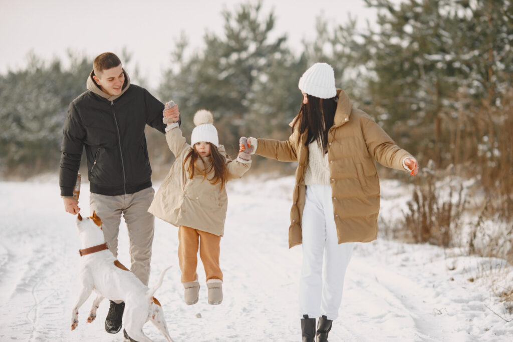 family in knitted winter hats on vacation