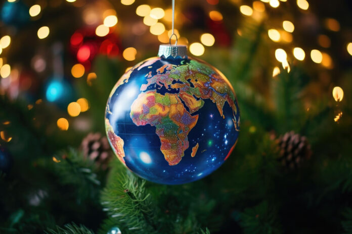 a globe ornament hanging from a christmas tree