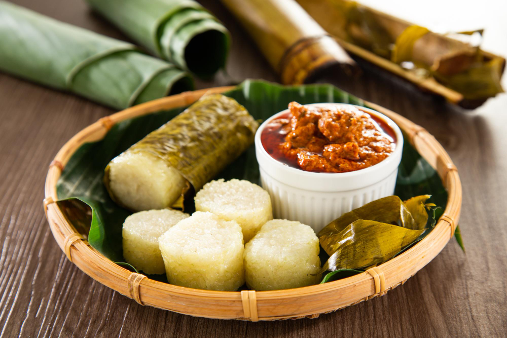 rice is wrapped with lerek or banana leaf encased in bamboo culm and cooked in open fire lemang