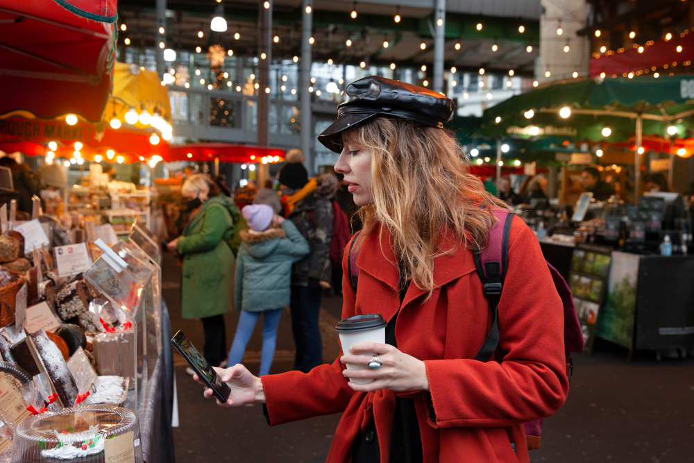 influencer taking photo of a cake at the market