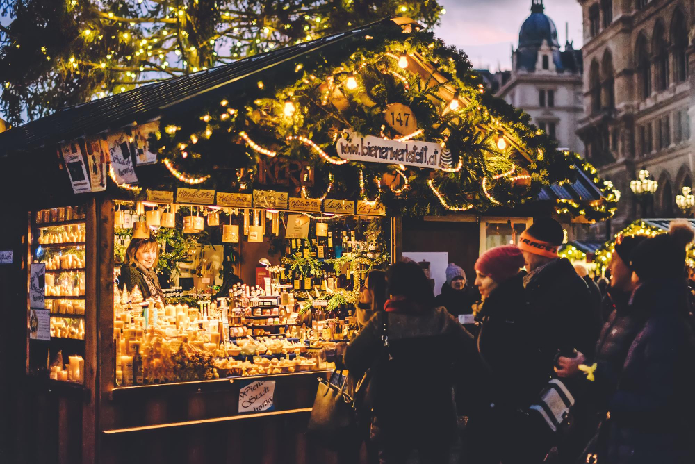 people buying souvenirs at christmas market