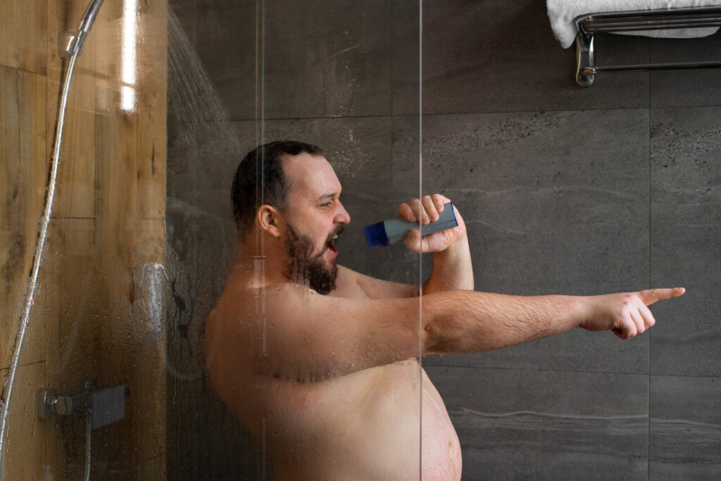 medium shot man singing in shower