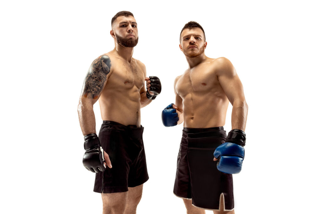 ready to grow up. two professional fighters posing isolated on white studio background