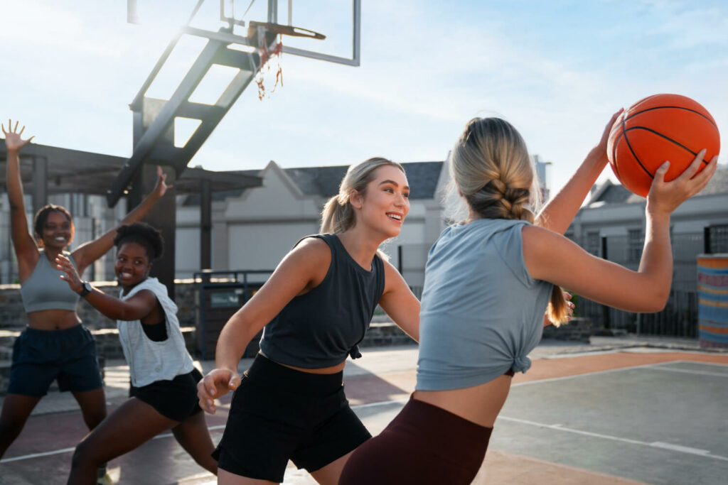 teenagers playing basketball