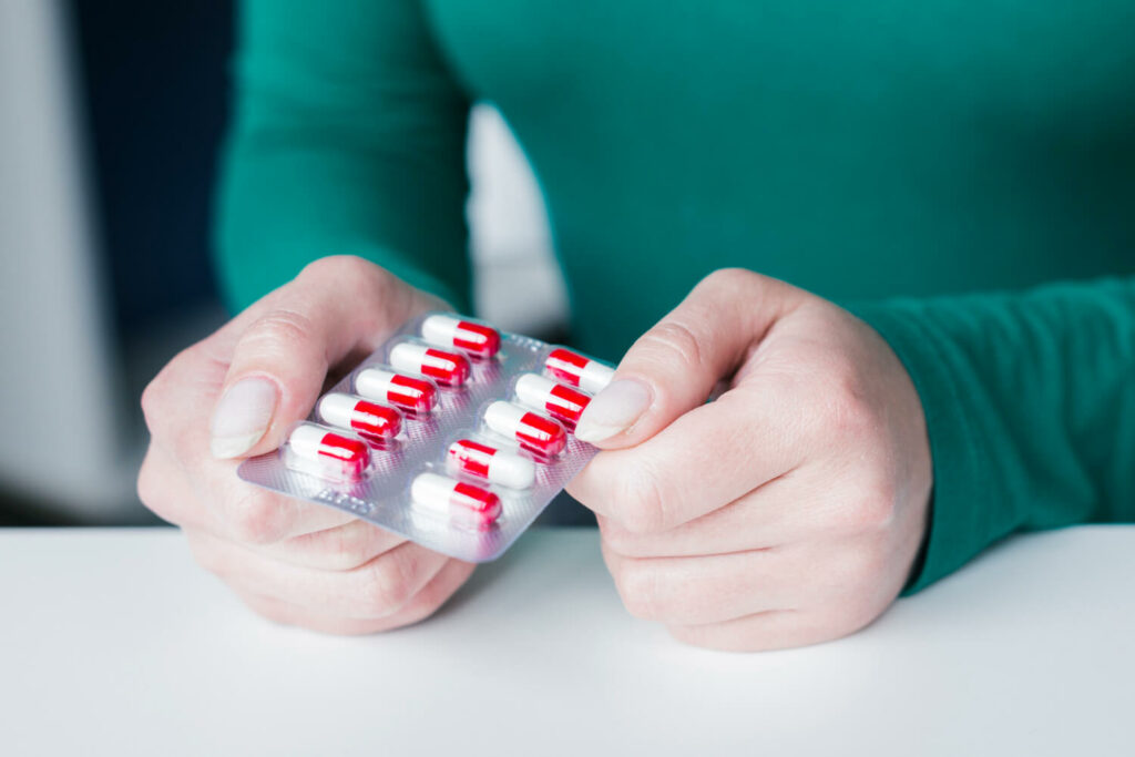 Adderall pills in a persons hand