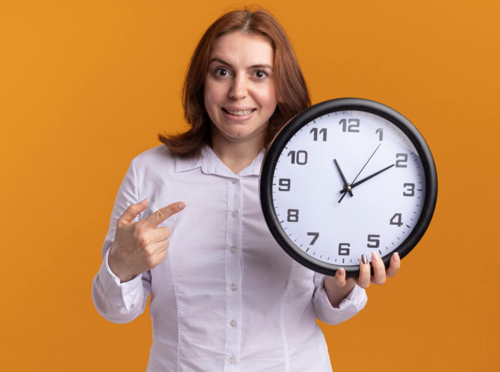 a person holding a clock